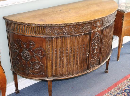 A Georgian style mahogany demi-lune sideboard W.137cm